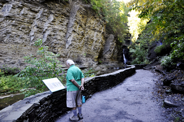 Lee Duquette reading a sign at Glen Cathedral